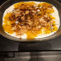 Riz au lait noix de coco cannelle et coulis de mangue 
